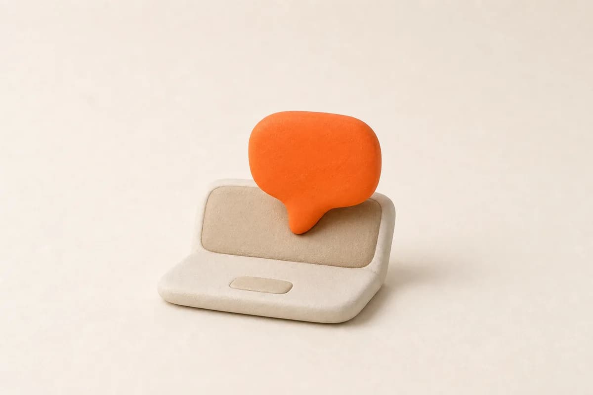 A small laptop-shaped tile with one rounded orange speech bubble rising from it.